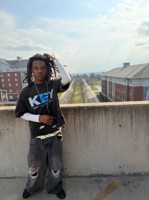 Black and blue Keep • Evolving • Young homeless tee